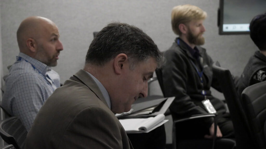 SPA employees listen as they find solutions to challenges together while meeting at HQ