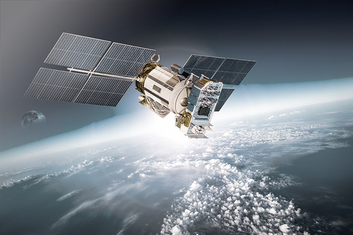 A stock image of a satellite orbiting in space