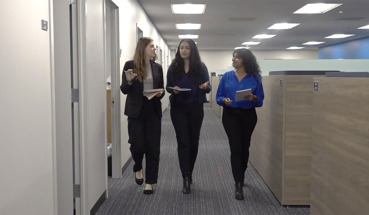 SPA employees walk and talk through the hallways at HQ