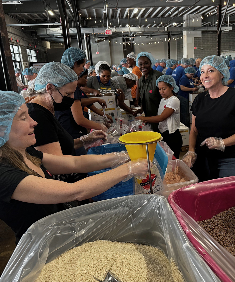 SPA employees volunteer to pack meals at the 9/11 Meal Pack event