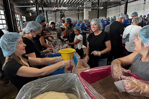 SPA employees volunteer to pack meals at the 9/11 Meal Pack event