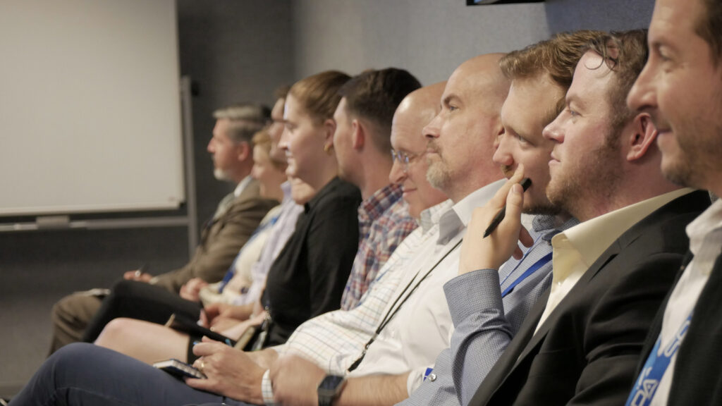 A row of SPA employees engaging during a meeting