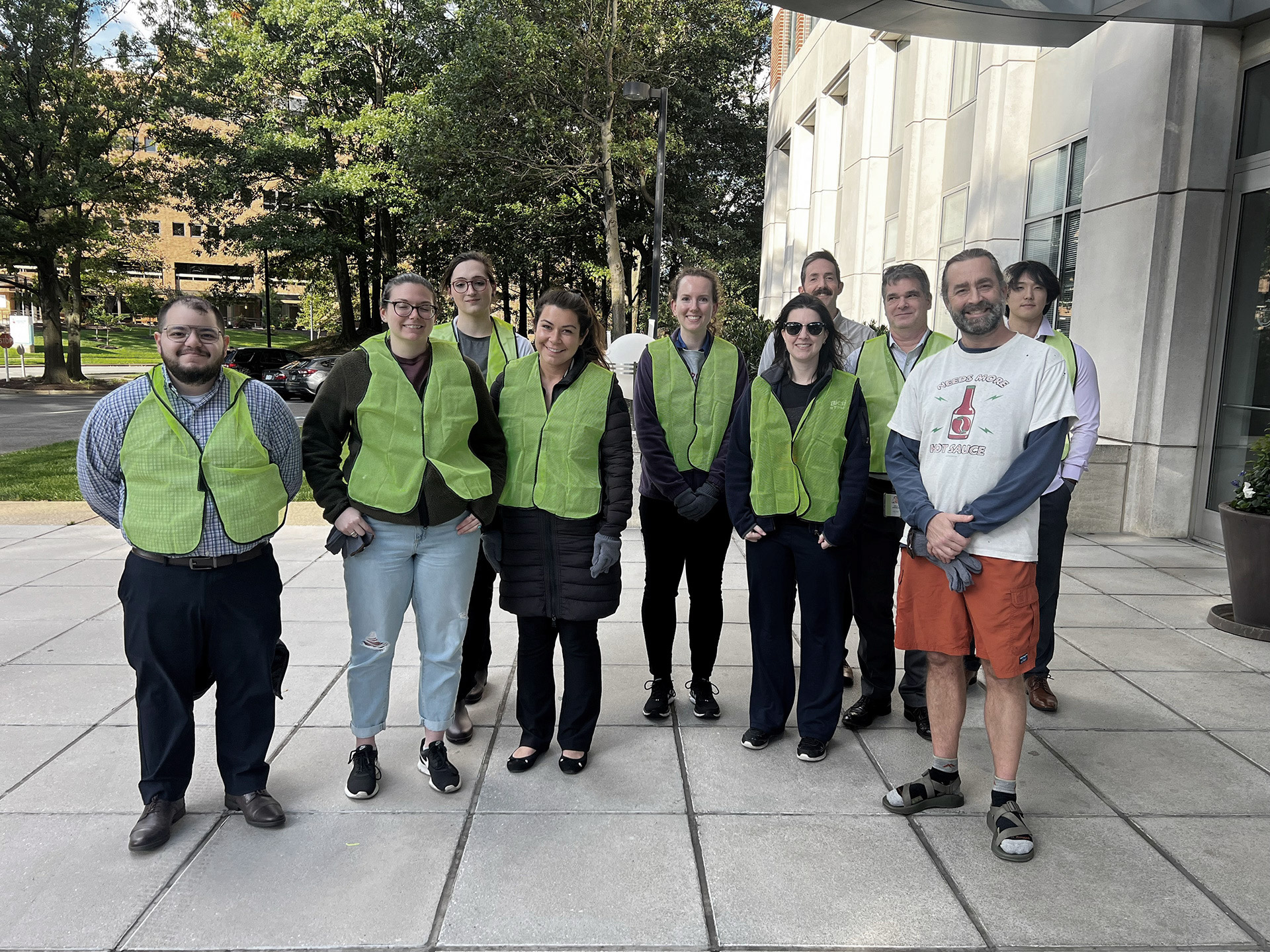 A group of SPA employees pose after cleaning up the highway together in the community