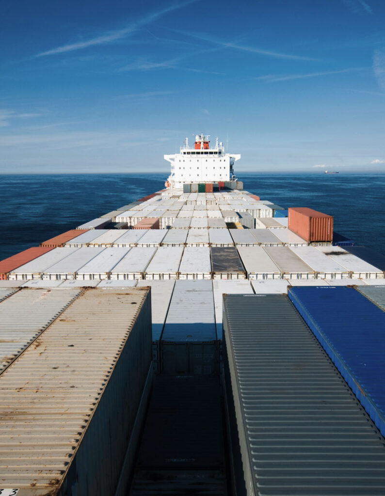 A stock image of a ship carrying goods depicting national security