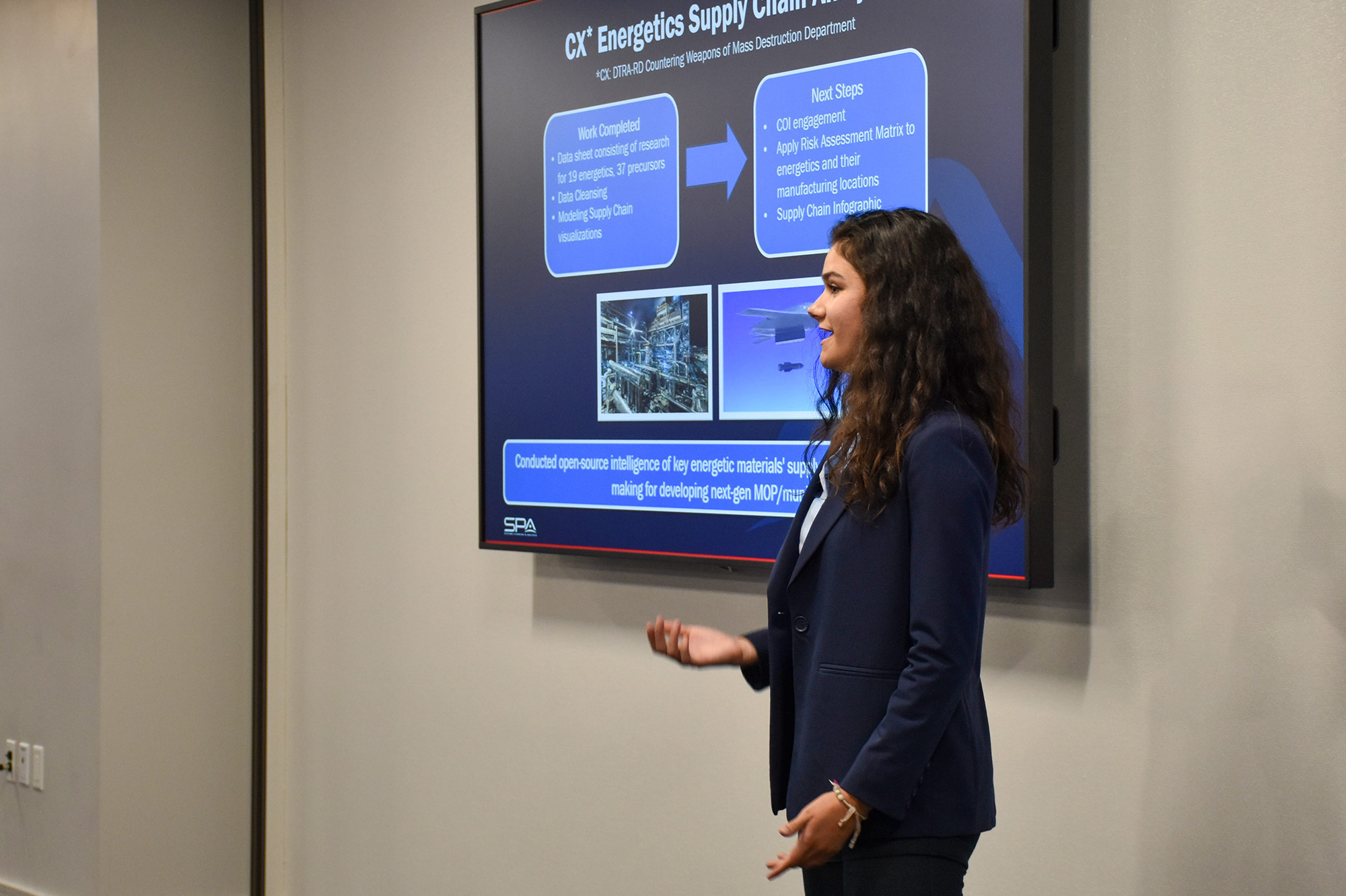 A young professional at SPA presents on a topic at HQ in Alexandria