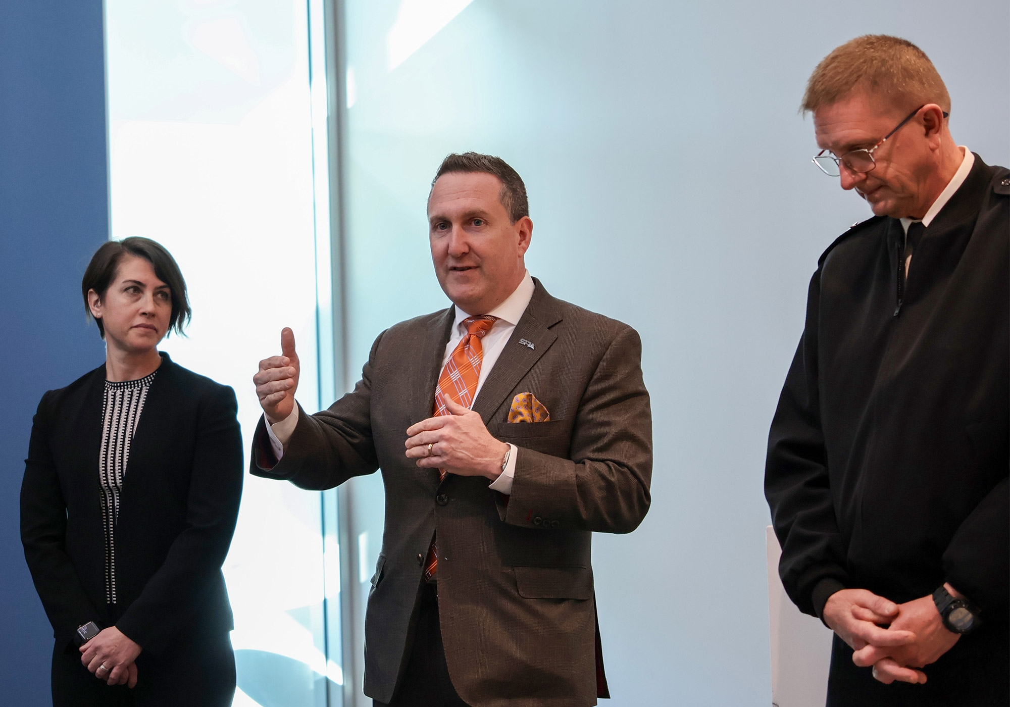 SPA Group Leader supporting Regional Strike Systems Julie McGlosson (left), SPA CEO Rich Sawchak (center), and Director of Strategic Systems Programs (SSP) VADM Johnny Wolfe Jr. (right) commemorate the opening of the new Maritime Plaza Collaboration Space. The leaders opened the event with remarks highlighting this significant milestone and the collaboration behind its success.