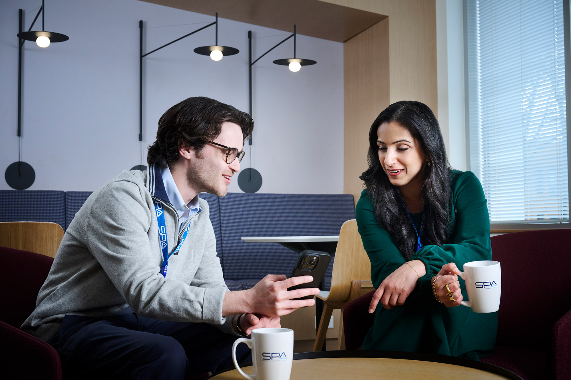 Young professionals at SPA meet in the cafe area at HQ