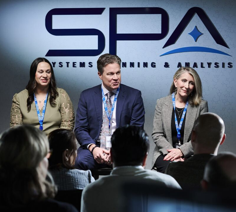 SPA employees speaking at an event